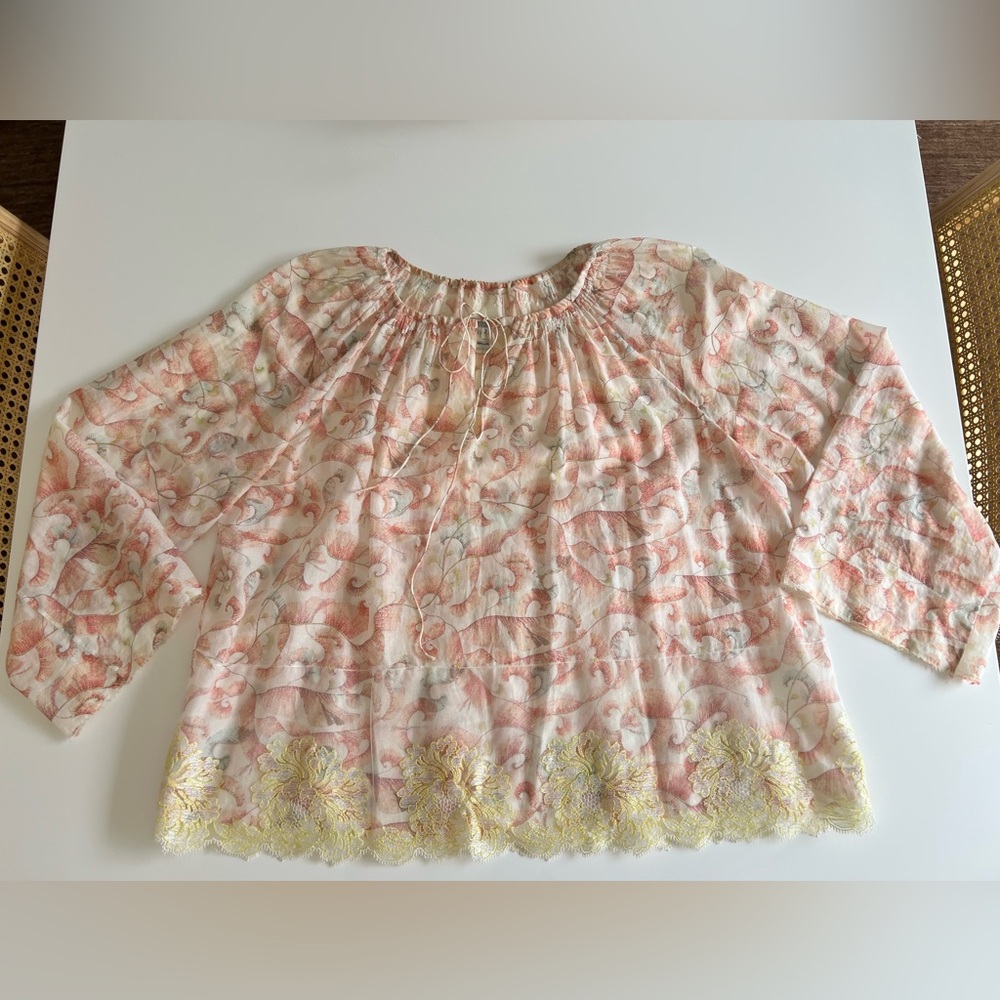 Dosa floral blouse with lace trim.